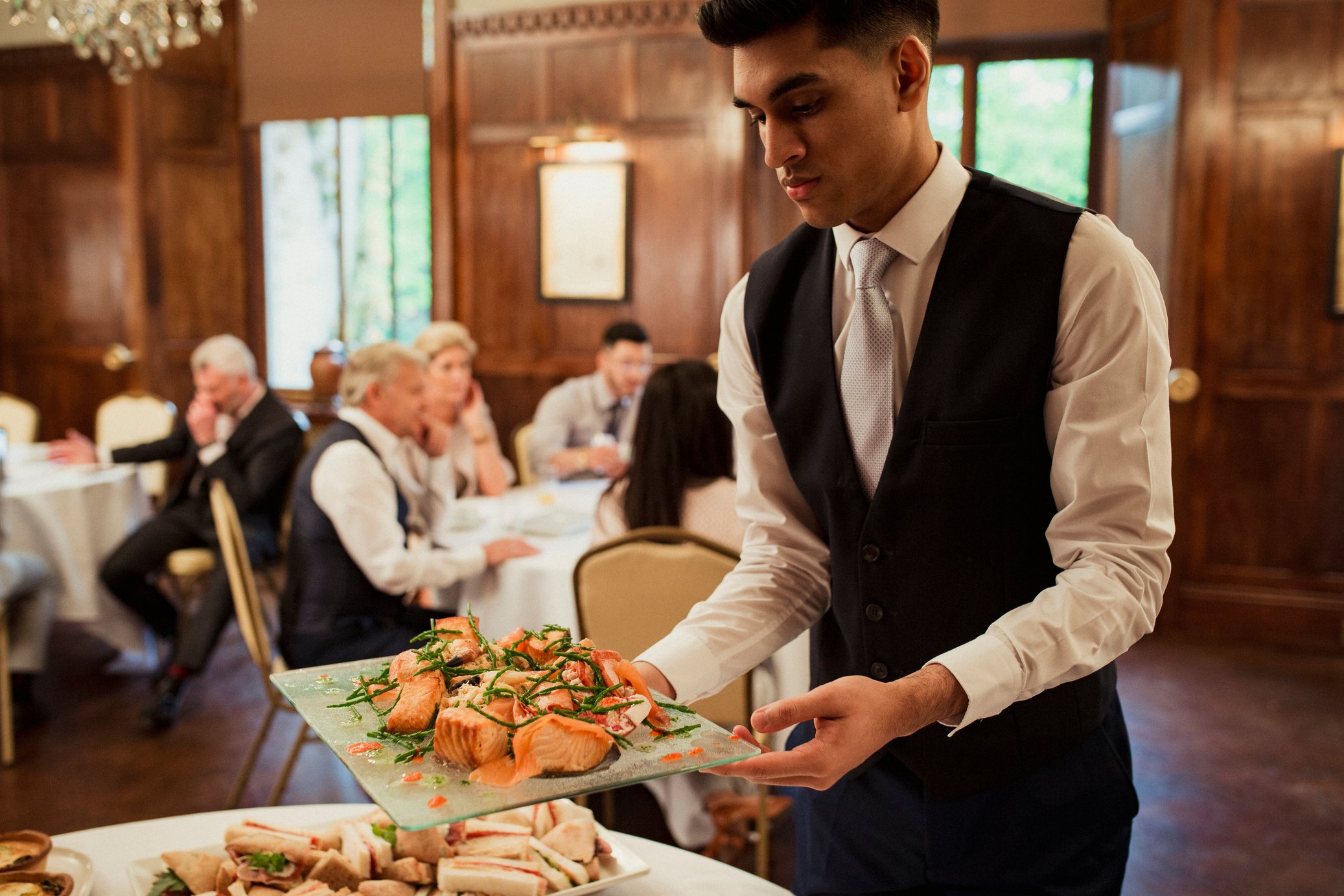 Waiter Catering a Business Meeting